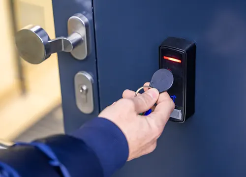Key-fob card access reader being mounted at a Brampton office building.