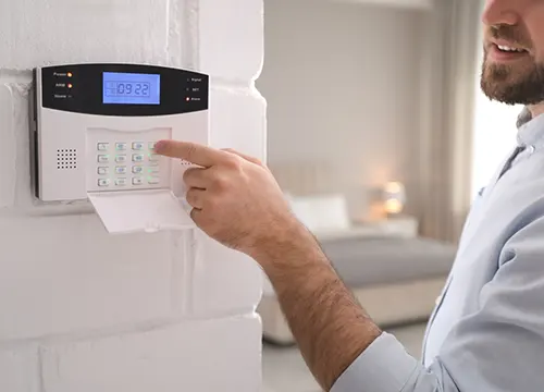 Comprehensive sensor kit including motion, glass-break, and smoke detectors being unpacked.