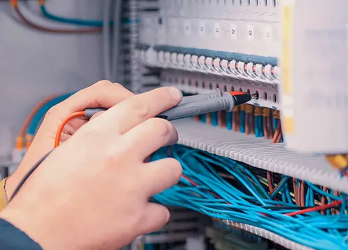 Close-up of structured cabling including Cat6 and coax lines.