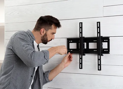 Flat-screen TV mounted with a full-motion articulating wall mount.